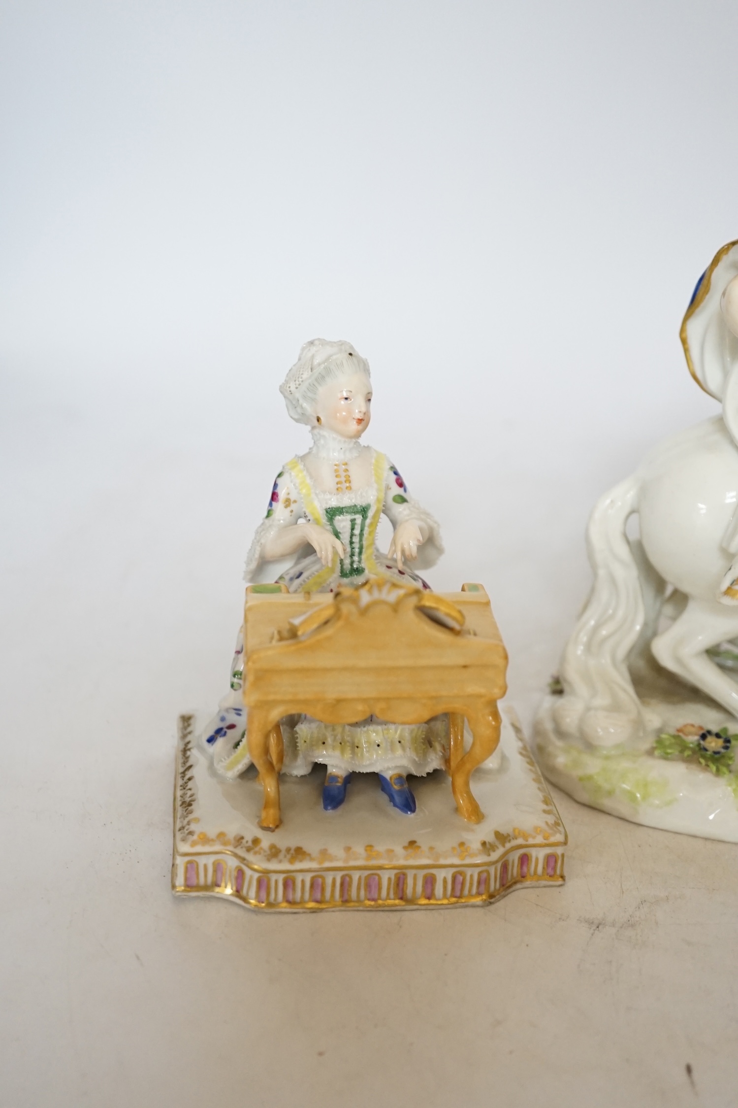 A 19th century Samson ‘Allegory or Continent of Europe’ figure group and a Vienna style pianist, tallest 19cm